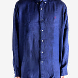 Navy shirts worn by a person, showing the shirts fit