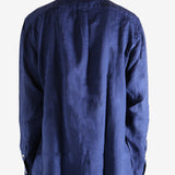 Navy shirts worn by a person, showing the shirts fit