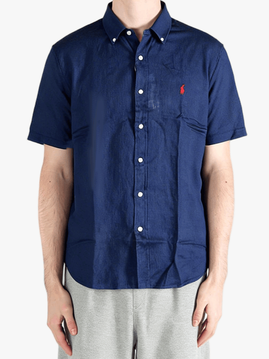 Navy shirts worn by a person, showing the shirts fit