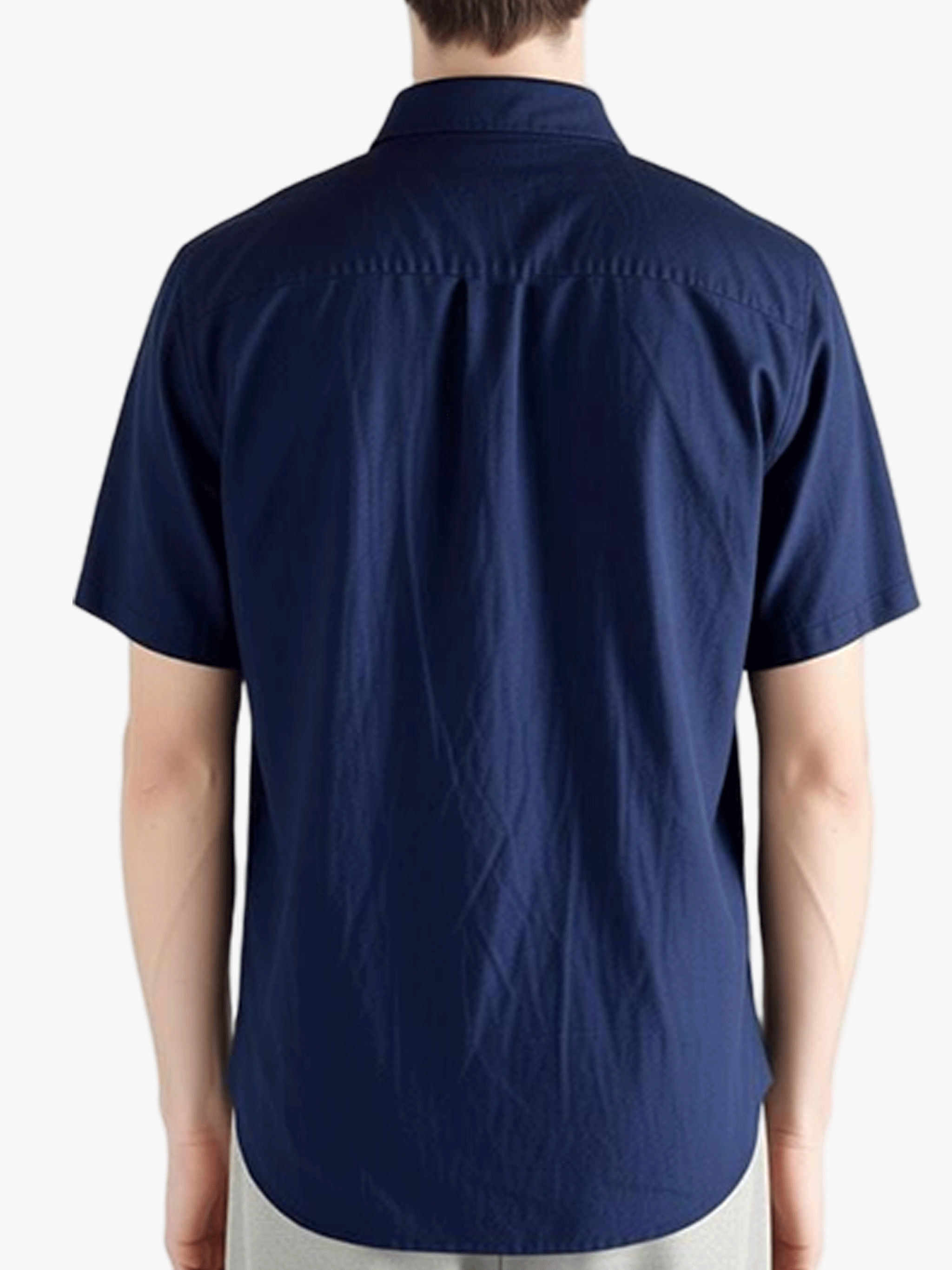 Navy shirts worn by a person, showing the shirts fit