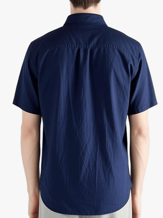 Navy shirts worn by a person, showing the shirts fit