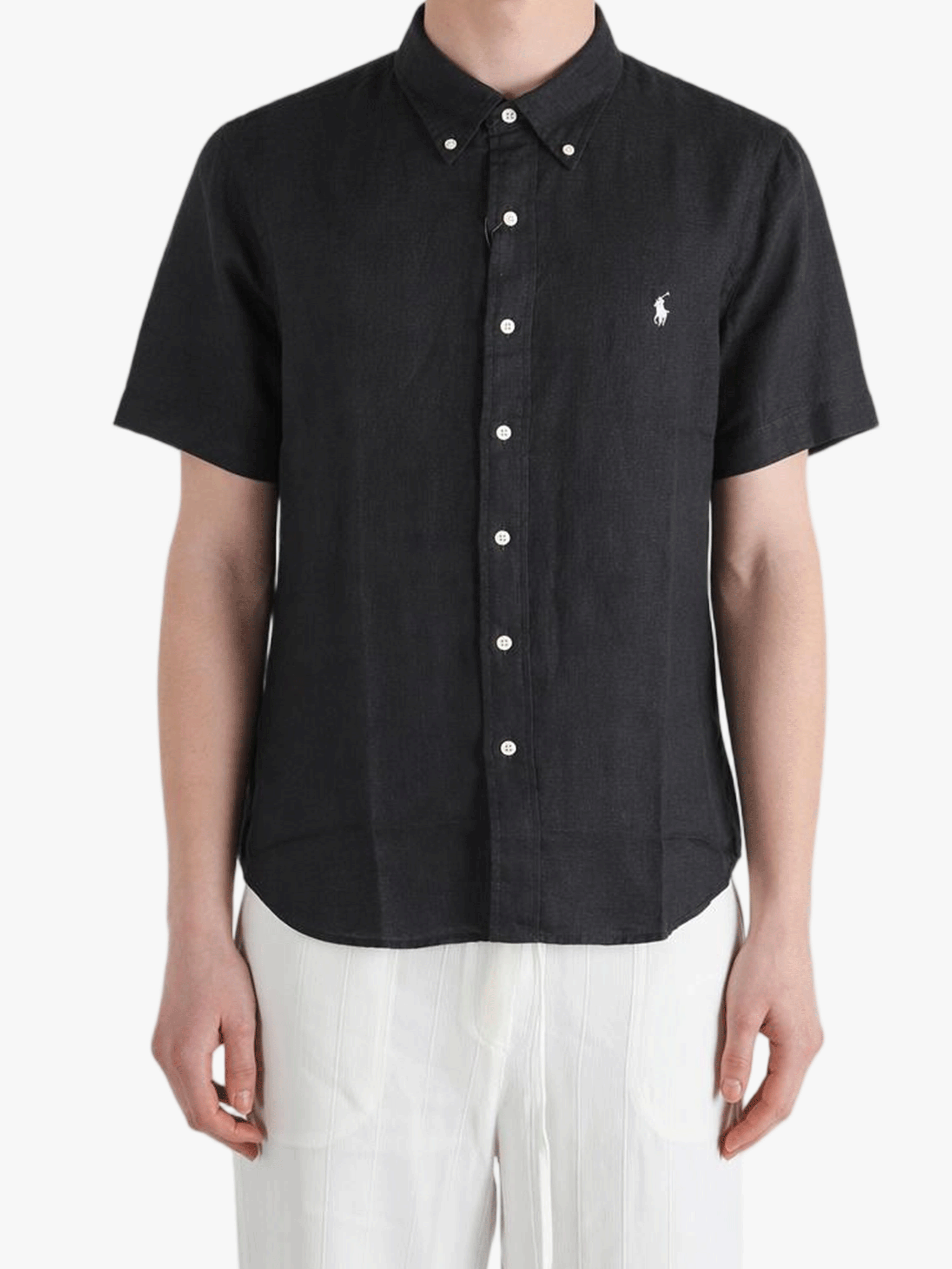 Black shirt worn by a person, showing the shirt fit