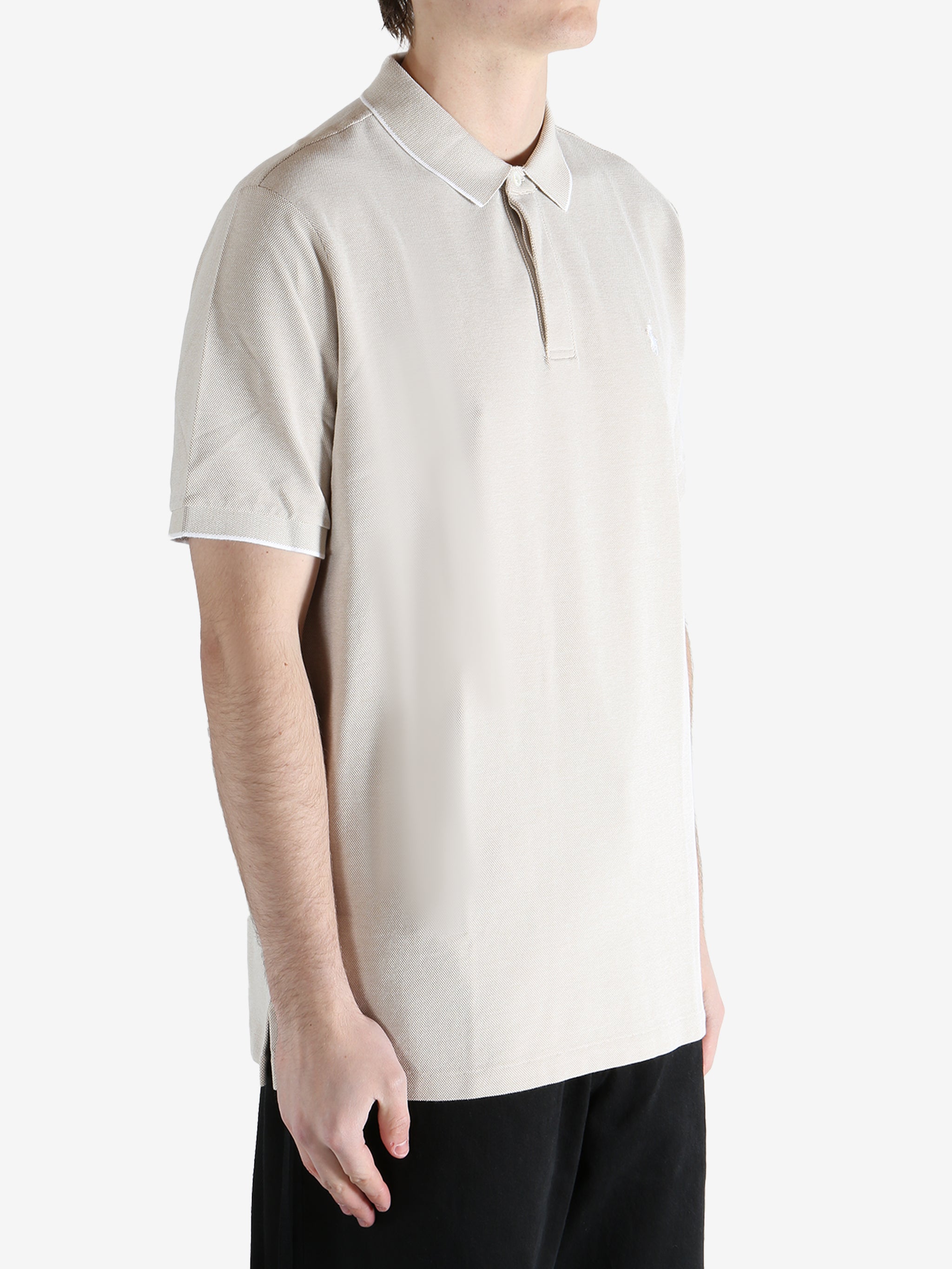 White t-shirt worn by a person, showing the shirt's fit