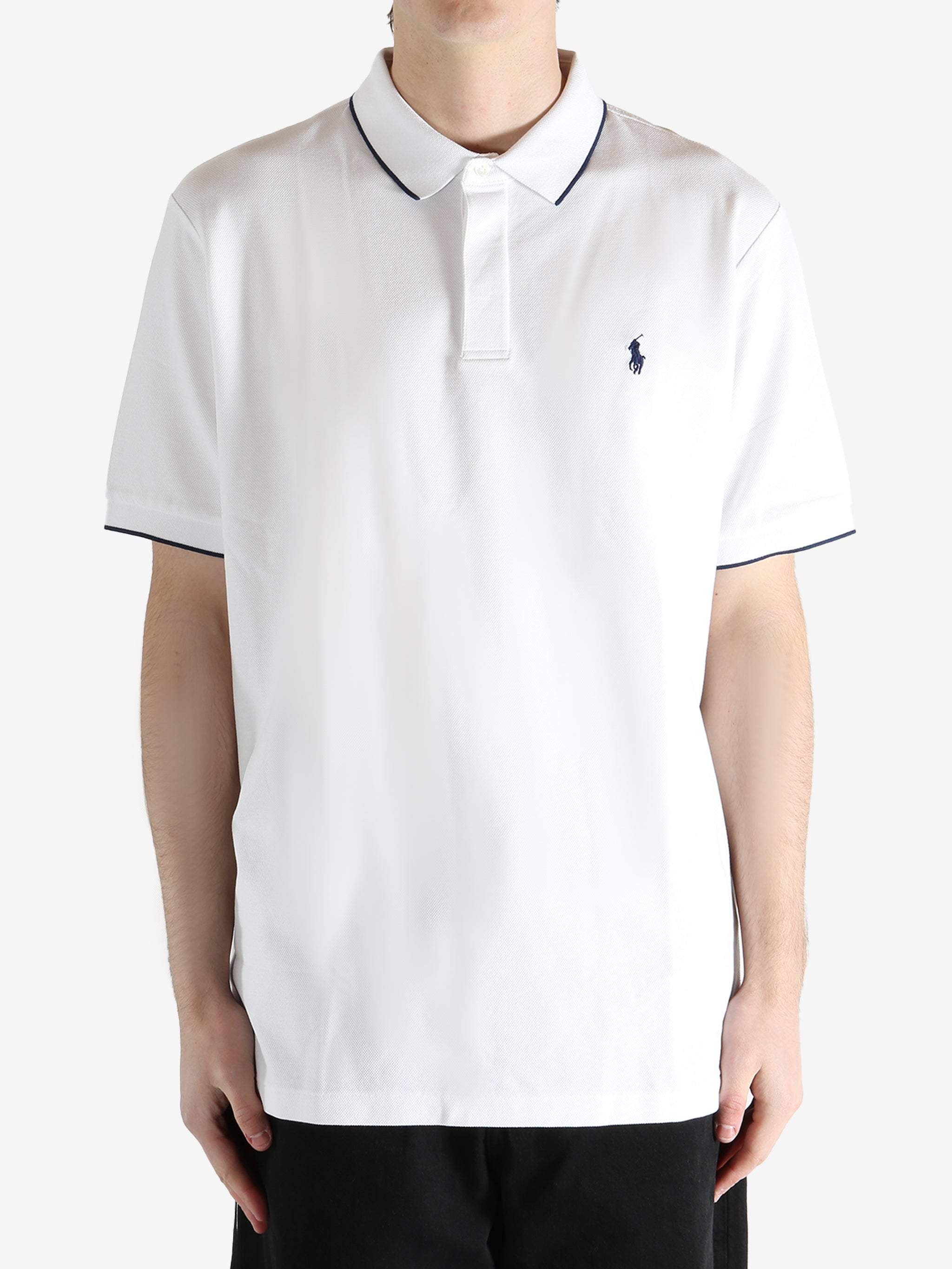 White t-shirt worn by a person, showing the t-shirt's fit