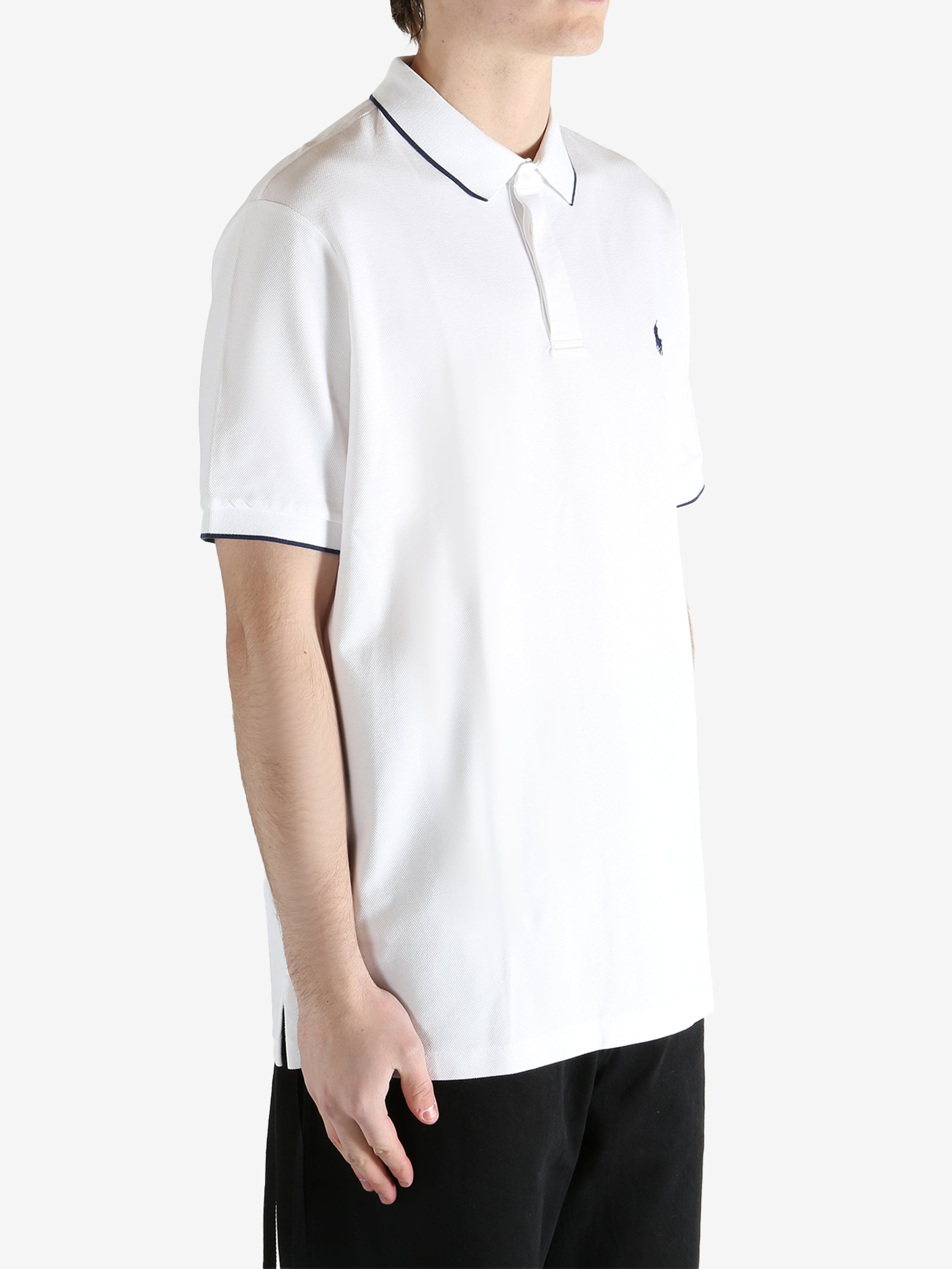 White t-shirt worn by a person, showing the t-shirt's fit