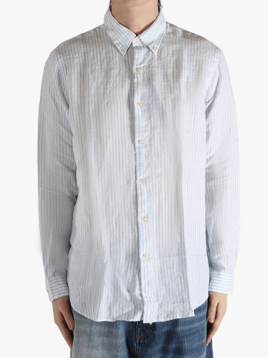 Blue shirt worn by a person, showing the shirt's fit