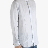 Blue shirt worn by a person, showing the shirt's fit