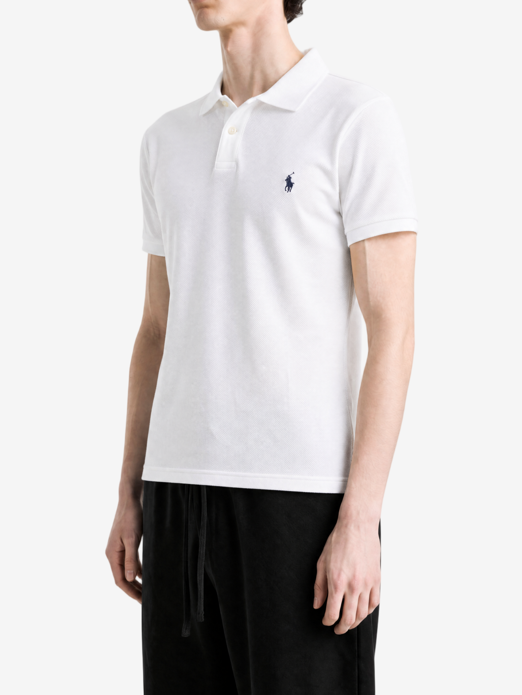 White t-shirt worn by a person, showing the t-shirt fit