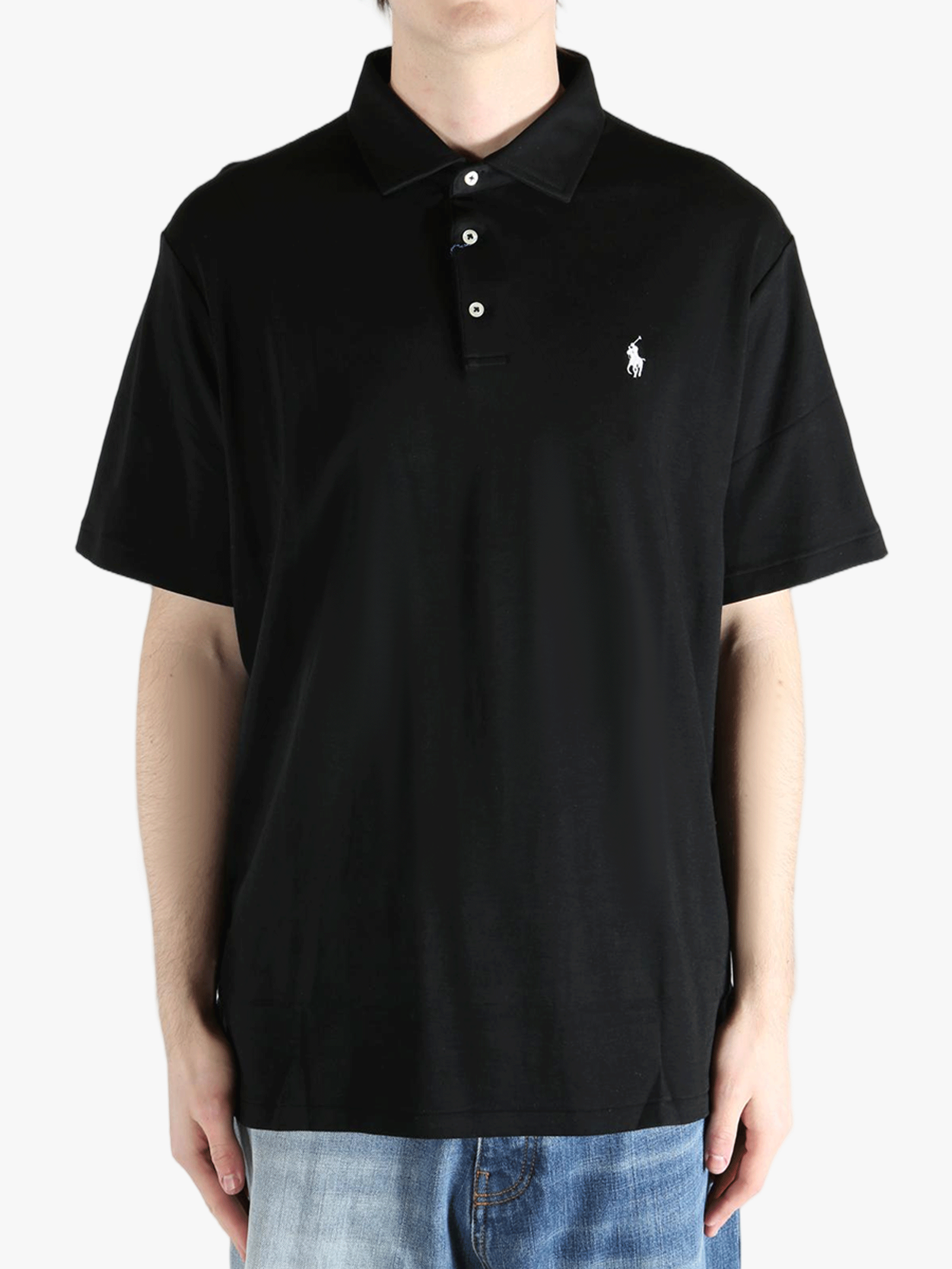 Black shirt worn by a person, showing the shirt's fit