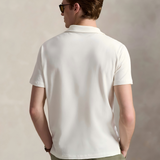 White shirt worn by a person, showing the shirt's fit