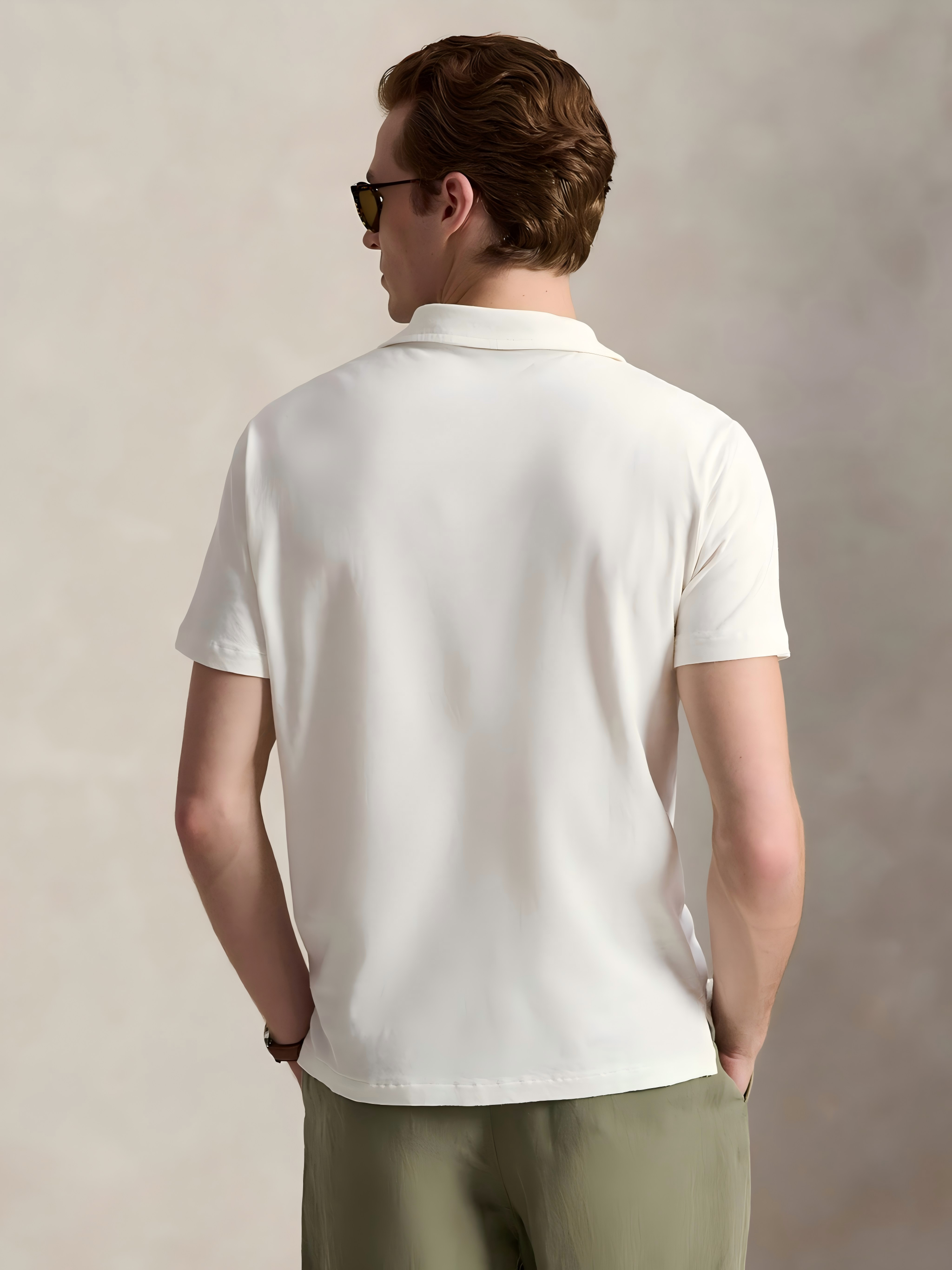 White shirt worn by a person, showing the shirt's fit
