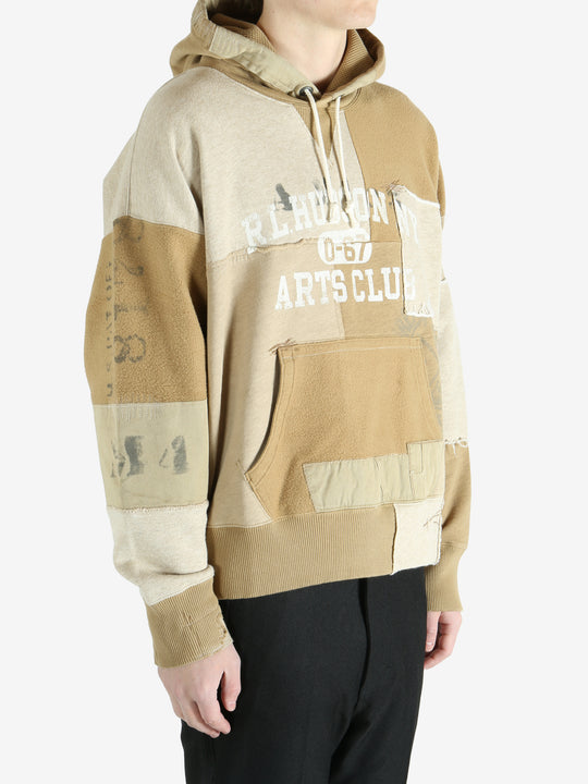 Tan hoodie worn by a person, showing the hoodie's fit