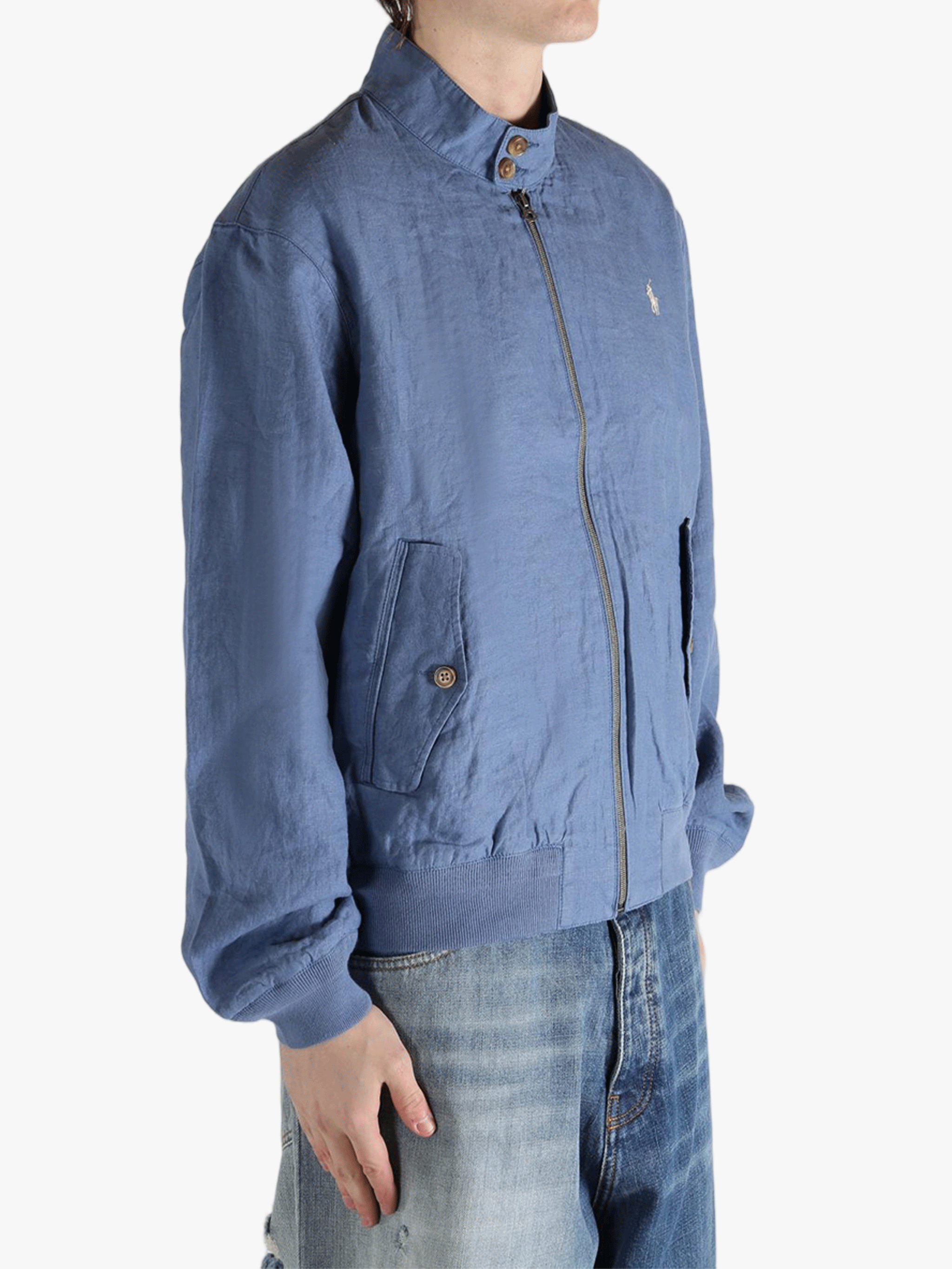 Blue jacket worn by a person, showing the jacket's fit