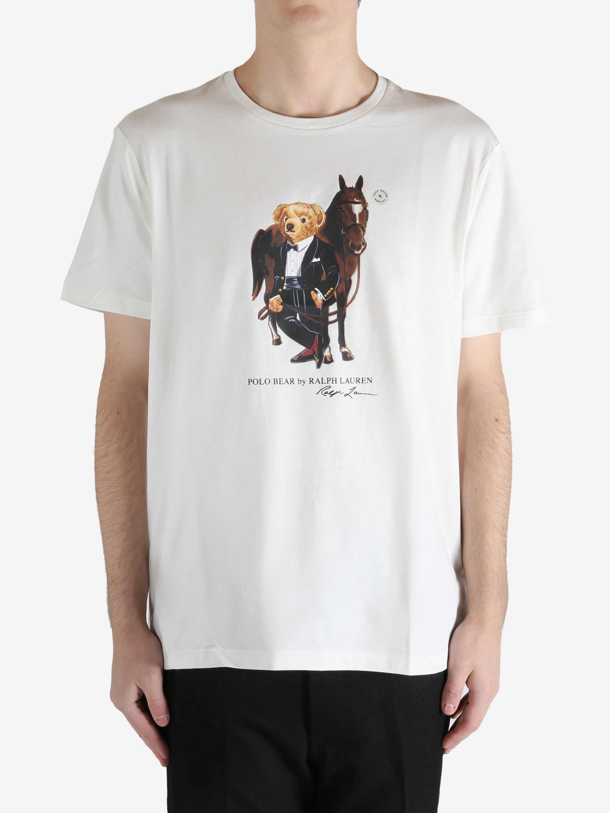 White T-shirt worn by a person, showing the T-shirt's fit