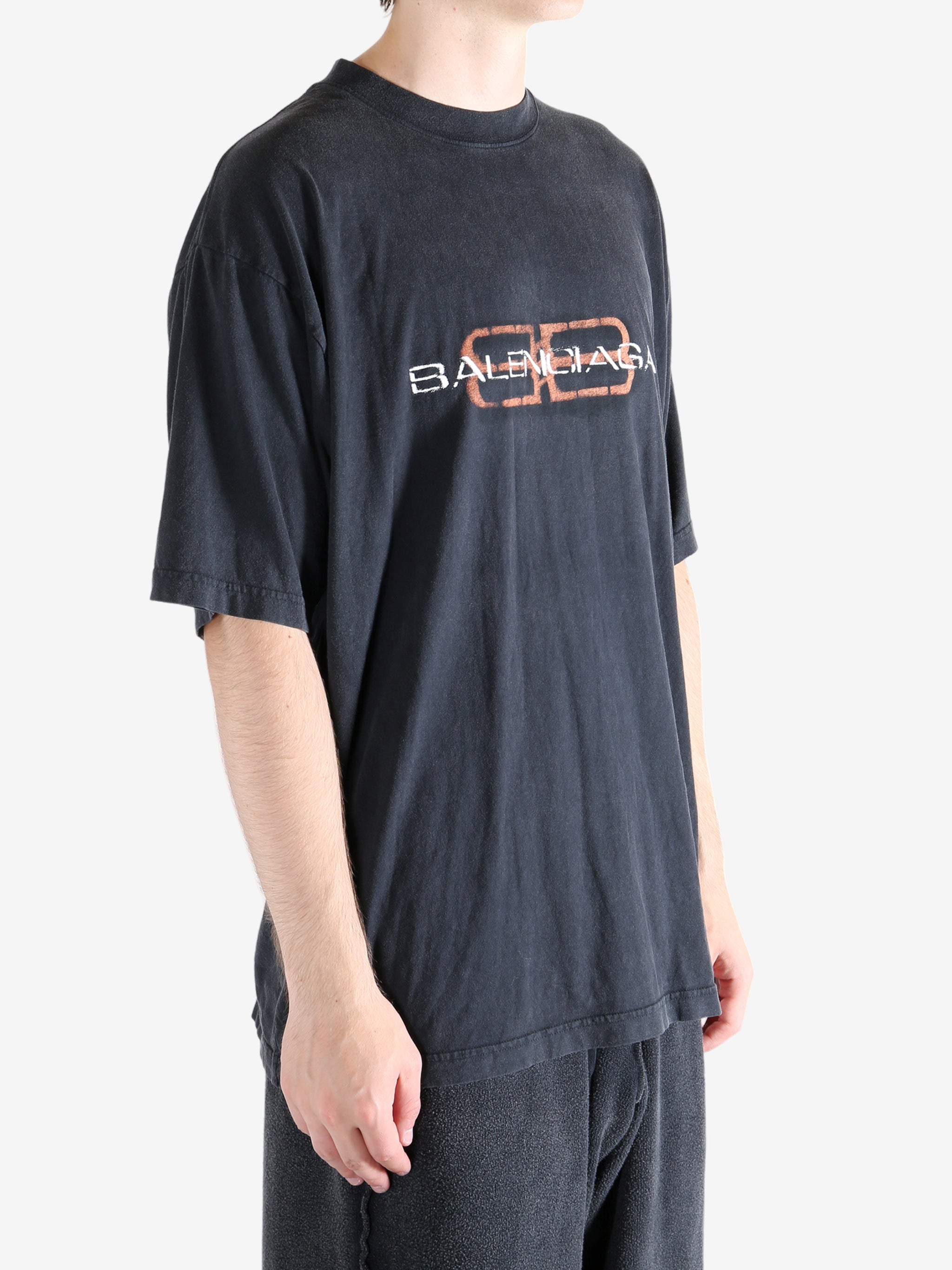 Black t-shirt worn by a person, showing the t-shirt's fit