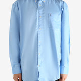 Blue shirt worn by a person, showing the shirt's fit