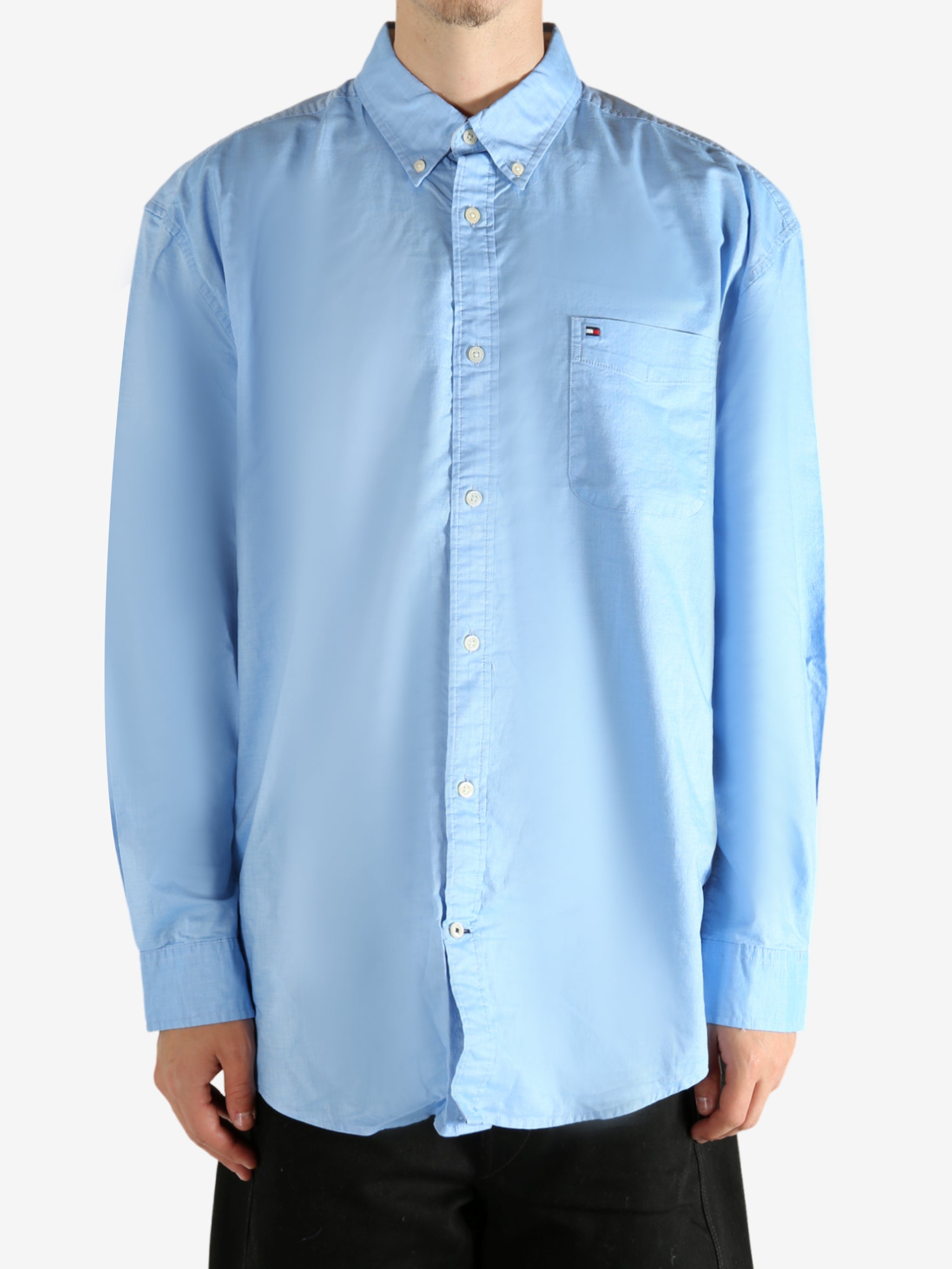 Blue shirt worn by a person, showing the shirt's fit