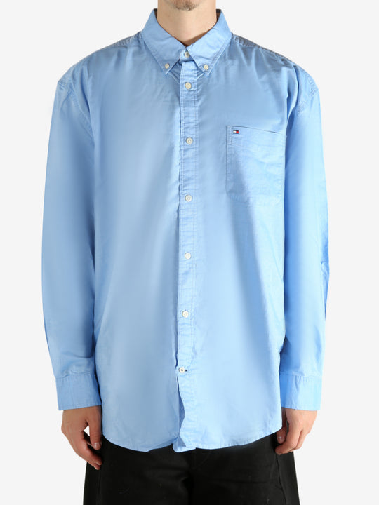Blue shirt worn by a person, showing the shirt's fit
