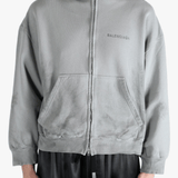 Grey hoodie worn by a person, showing the hoodies fit