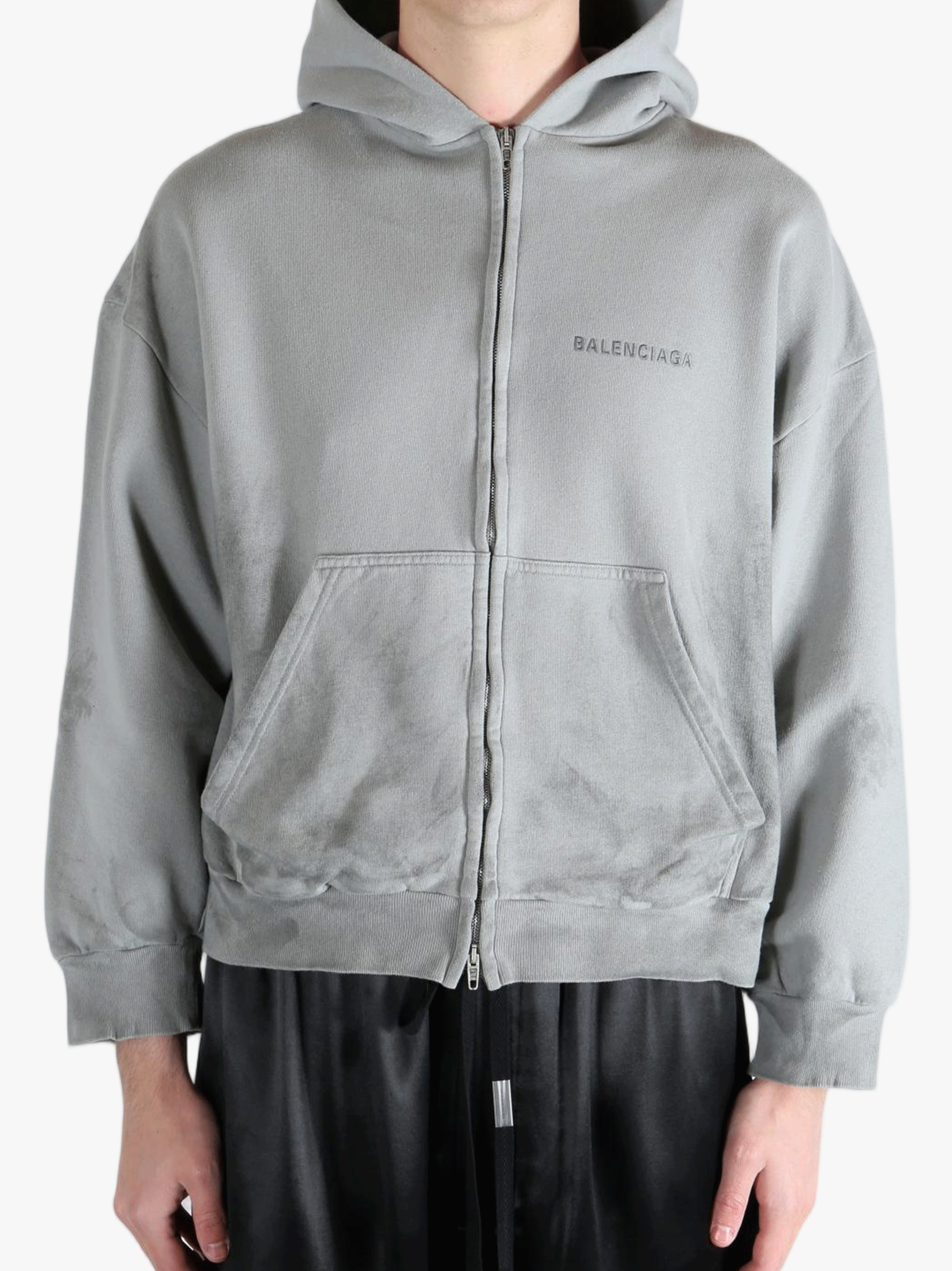 Grey hoodie worn by a person, showing the hoodies fit