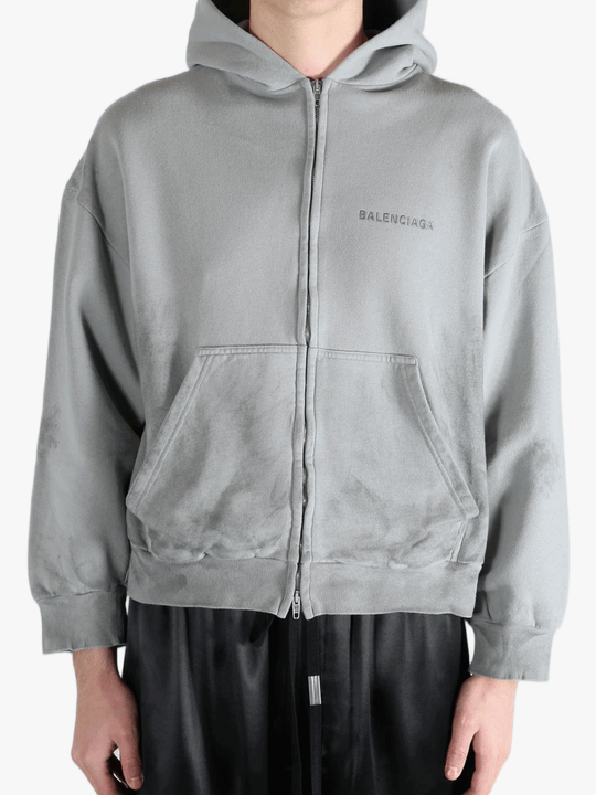 Grey hoodie worn by a person, showing the hoodies fit
