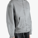 Grey hoodie worn by a person, showing the hoodies fit
