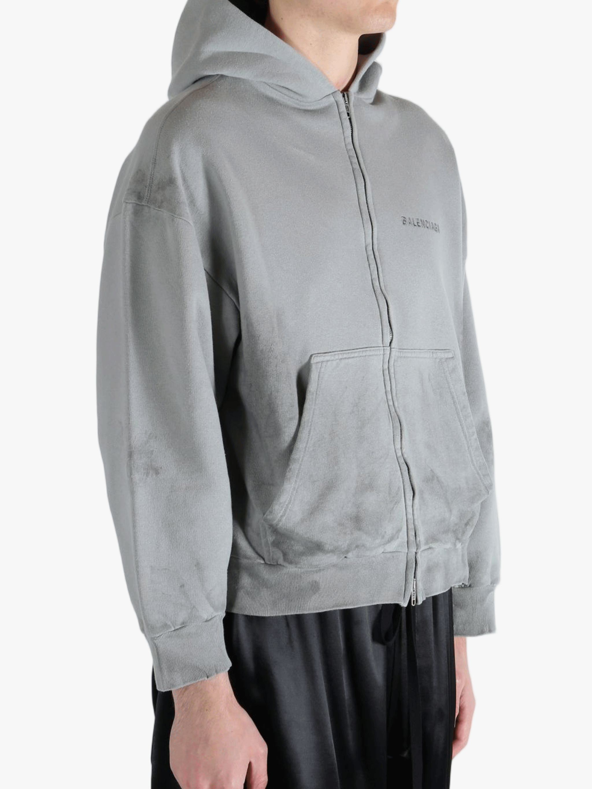 Grey hoodie worn by a person, showing the hoodies fit