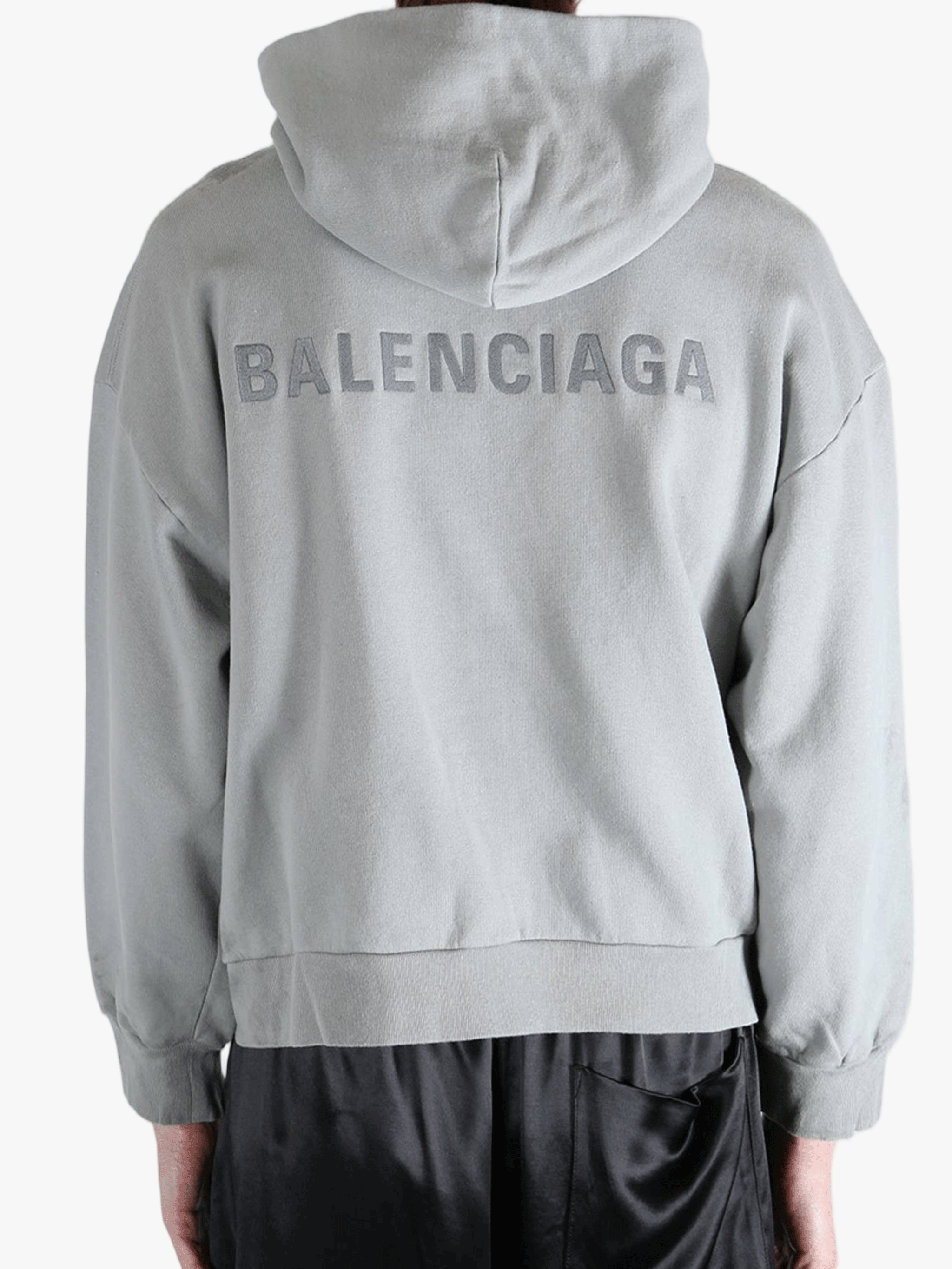 Grey hoodie worn by a person, showing the hoodies fit