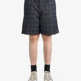 Black pants worn by a person, showing the pants fit