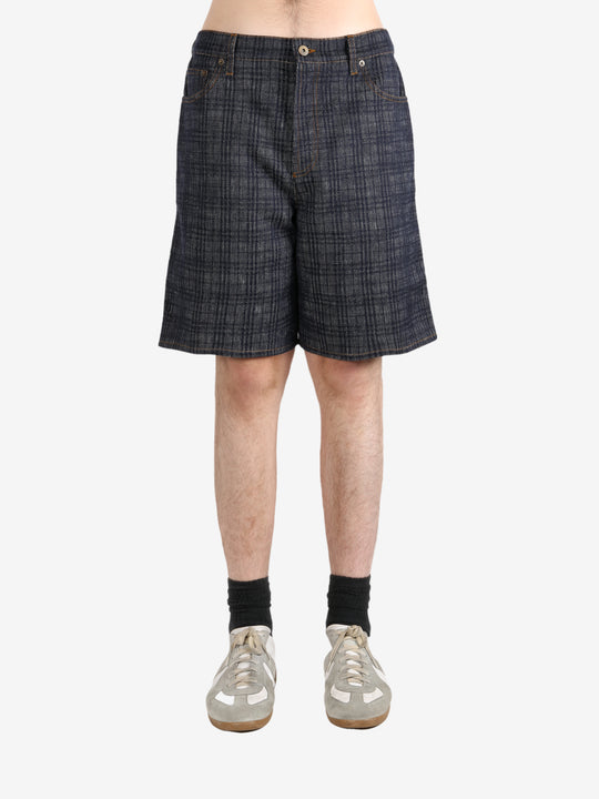 Black pants worn by a person, showing the pants fit