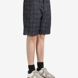 Black pants worn by a person, showing the pants fit