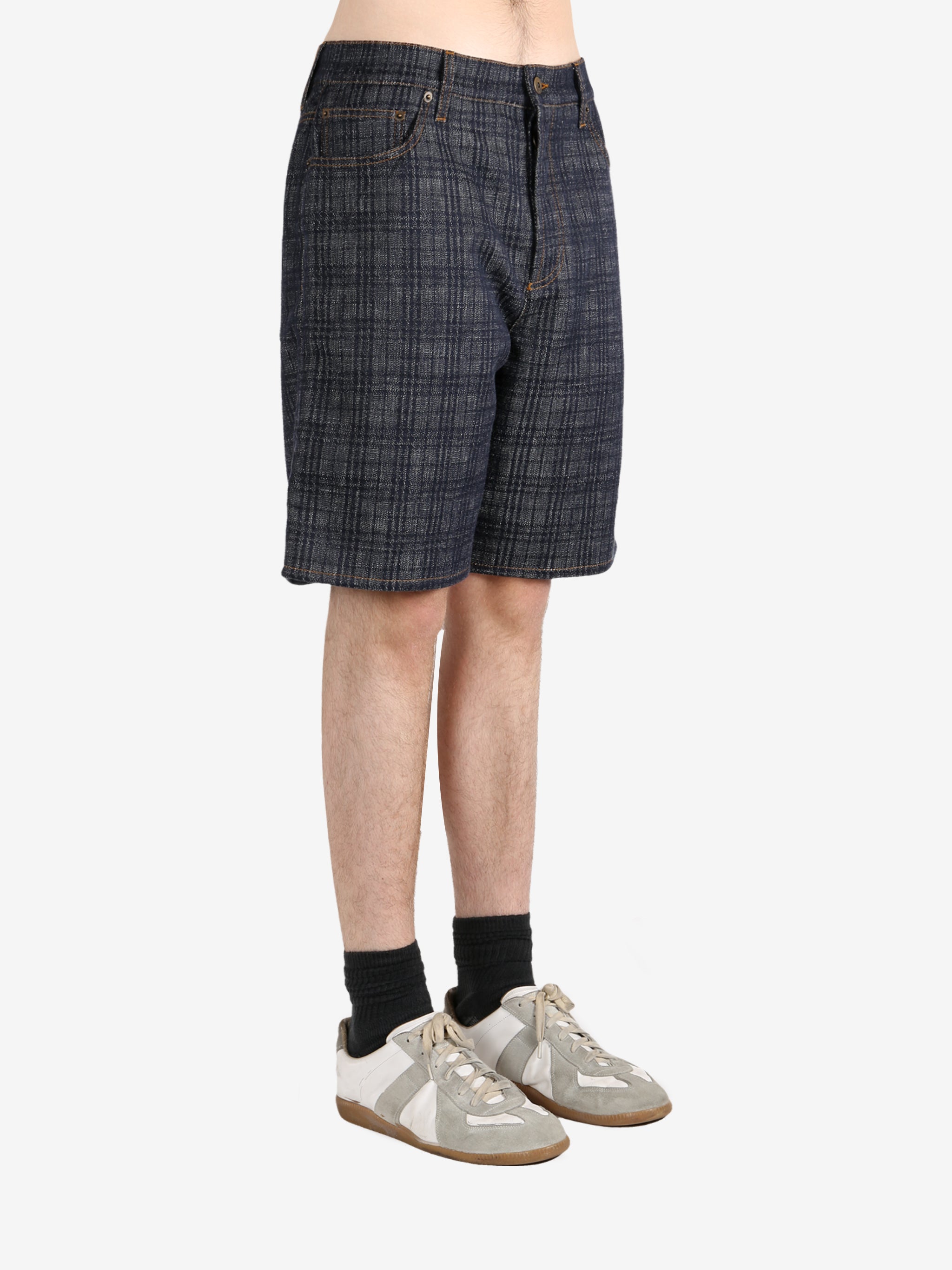 Black pants worn by a person, showing the pants fit