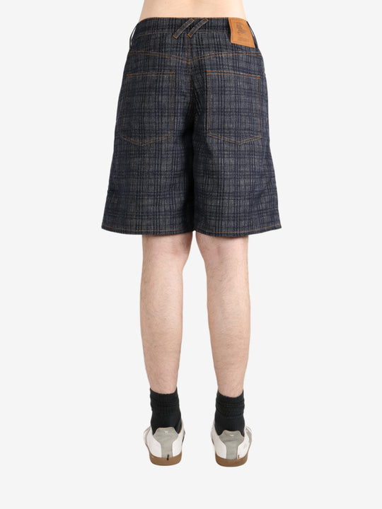 Black pants worn by a person, showing the pants fit