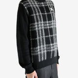 Black Sweater worn by a person, showing the sweater's fit