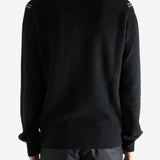 Black Sweater worn by a person, showing the sweater's fit