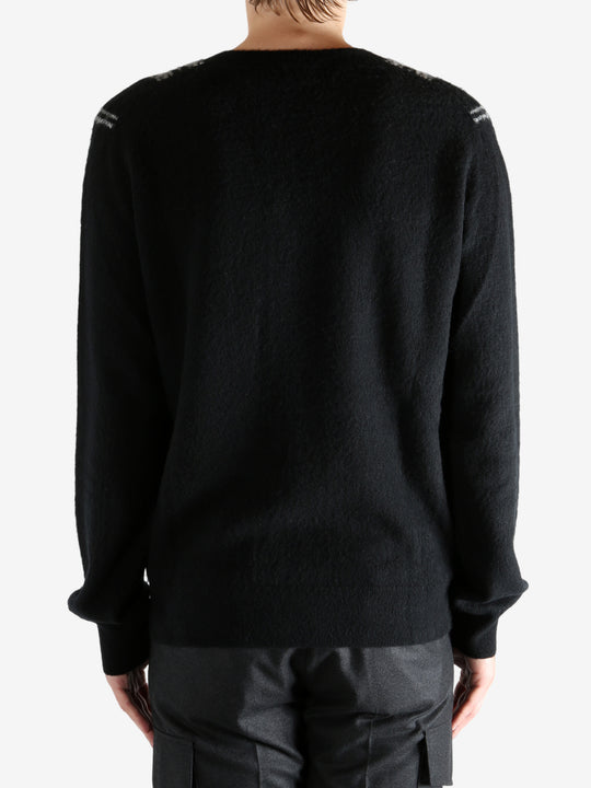 Black Sweater worn by a person, showing the sweater's fit