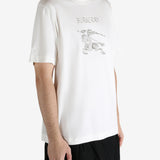 White t-shirt worn by a person, showing the t-shirt's fit