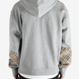  Grey jacket worn by a person, showing the jacket fit