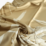 Close up of yellow scarf, showing texture of the silk fabric