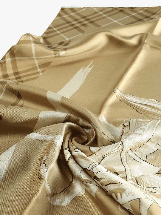 Close up of yellow scarf, showing texture of the silk fabric