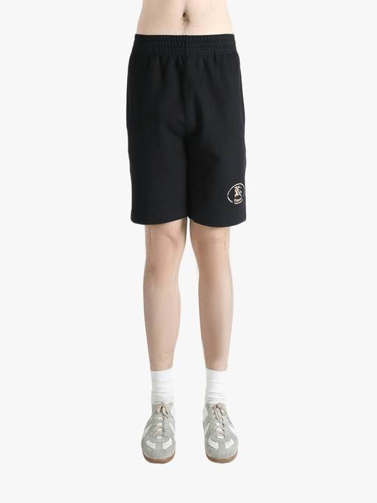 Black short worn by a person, showing the short's fit