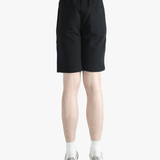 Black short worn by a person, showing the short's fit