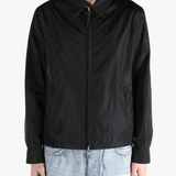 Black jacket worn by a person, showing the  jacket's fit