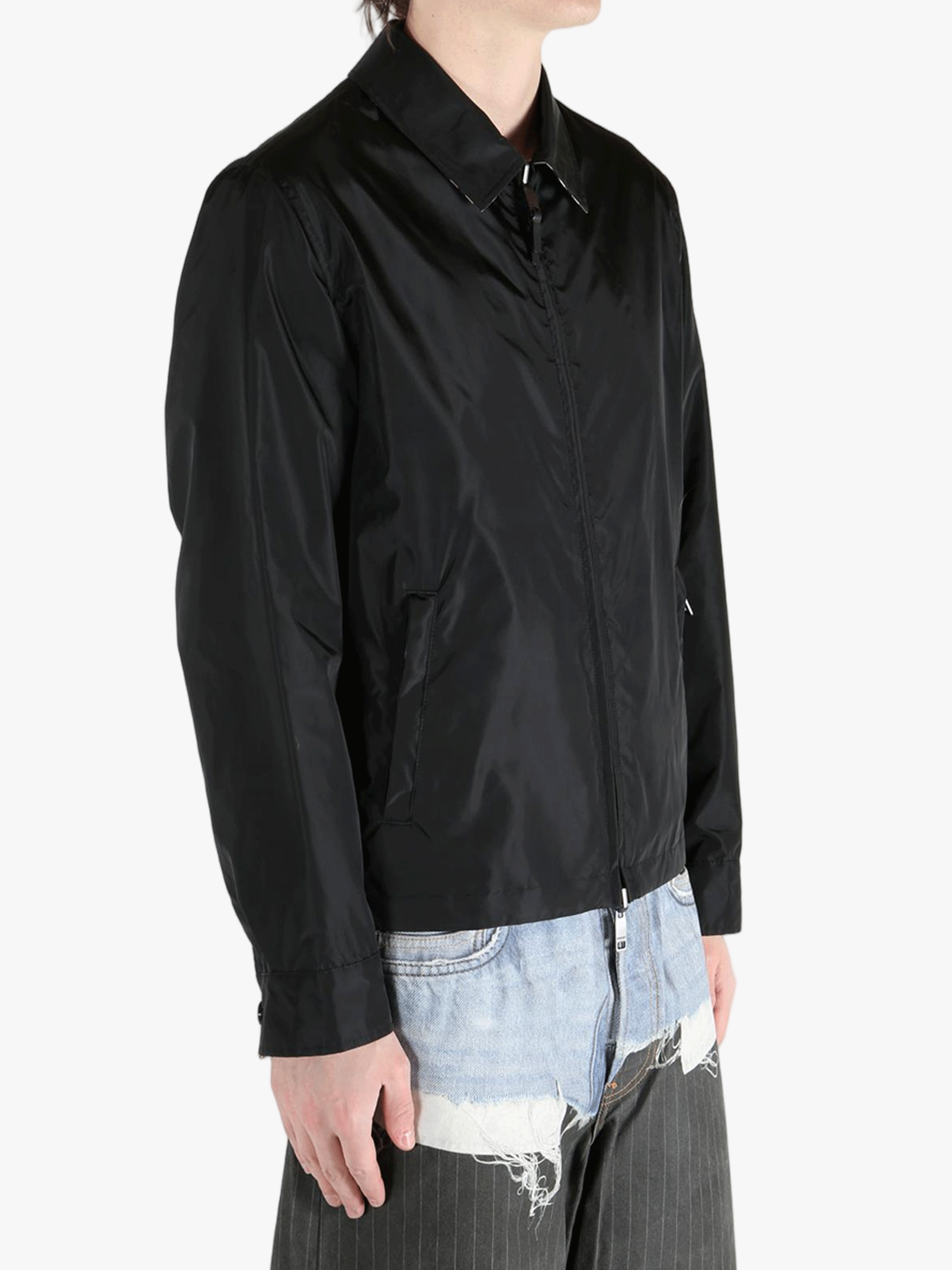 Black jacket worn by a person, showing the  jacket's fit