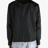 Black jacket worn by a person, showing the  jacket's fit
