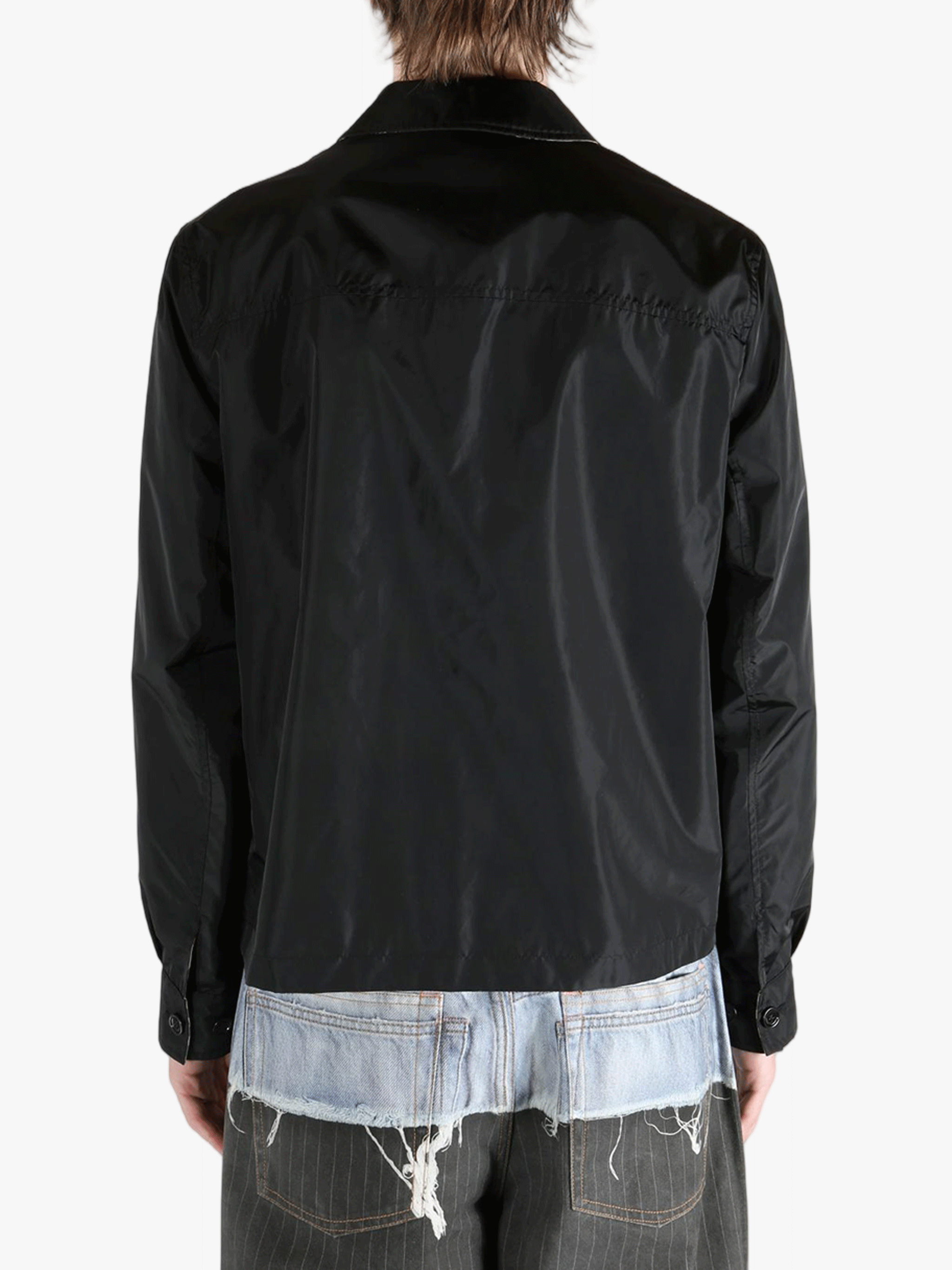 Black jacket worn by a person, showing the  jacket's fit