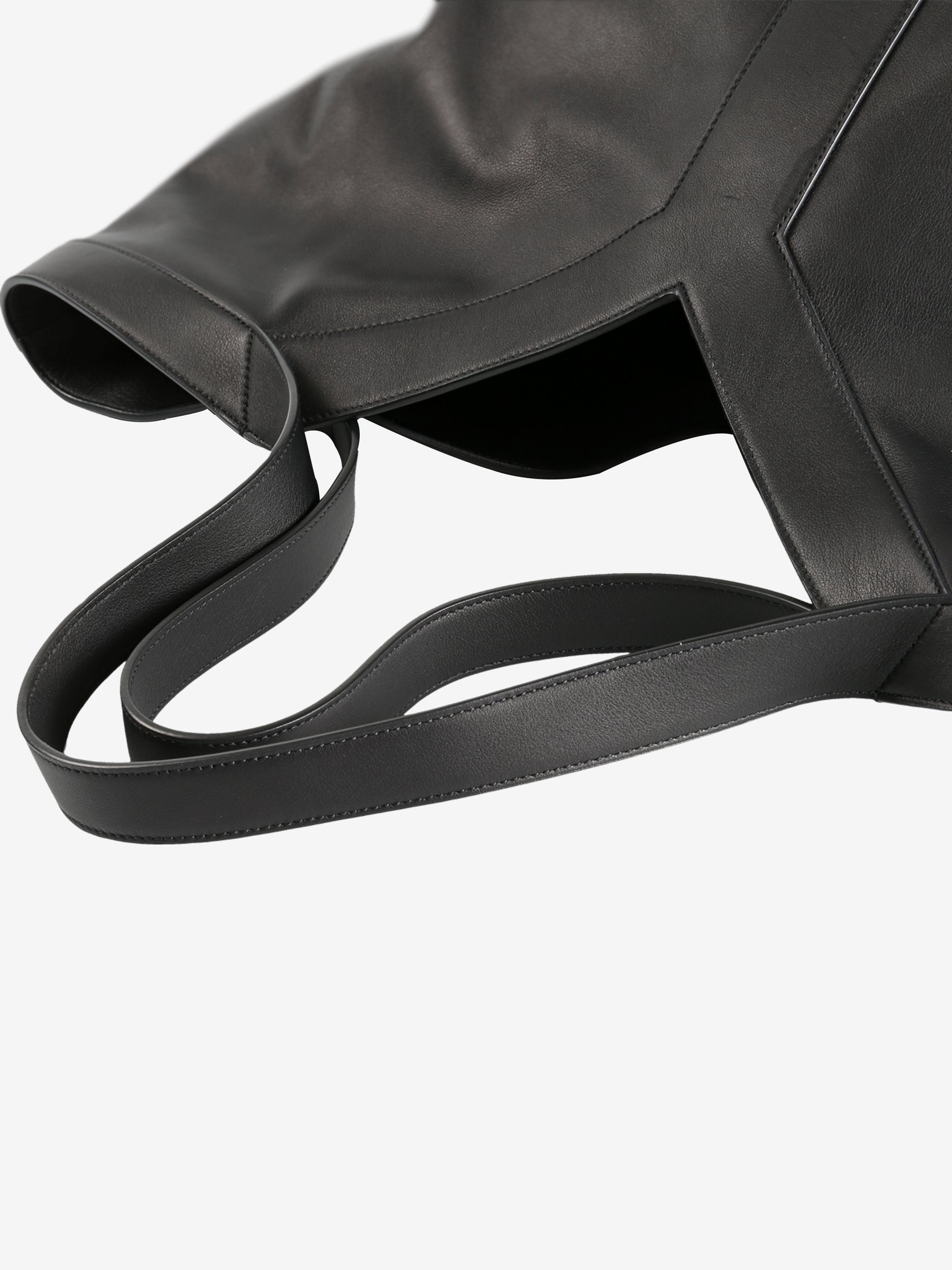 Close up of black bags,showing texture of the leather fabric.