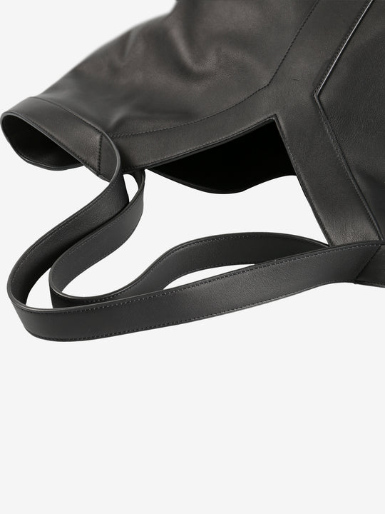 Close up of black bags,showing texture of the leather fabric.