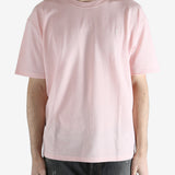 Pink t-shirts worn by a person, showing the shirt's fit