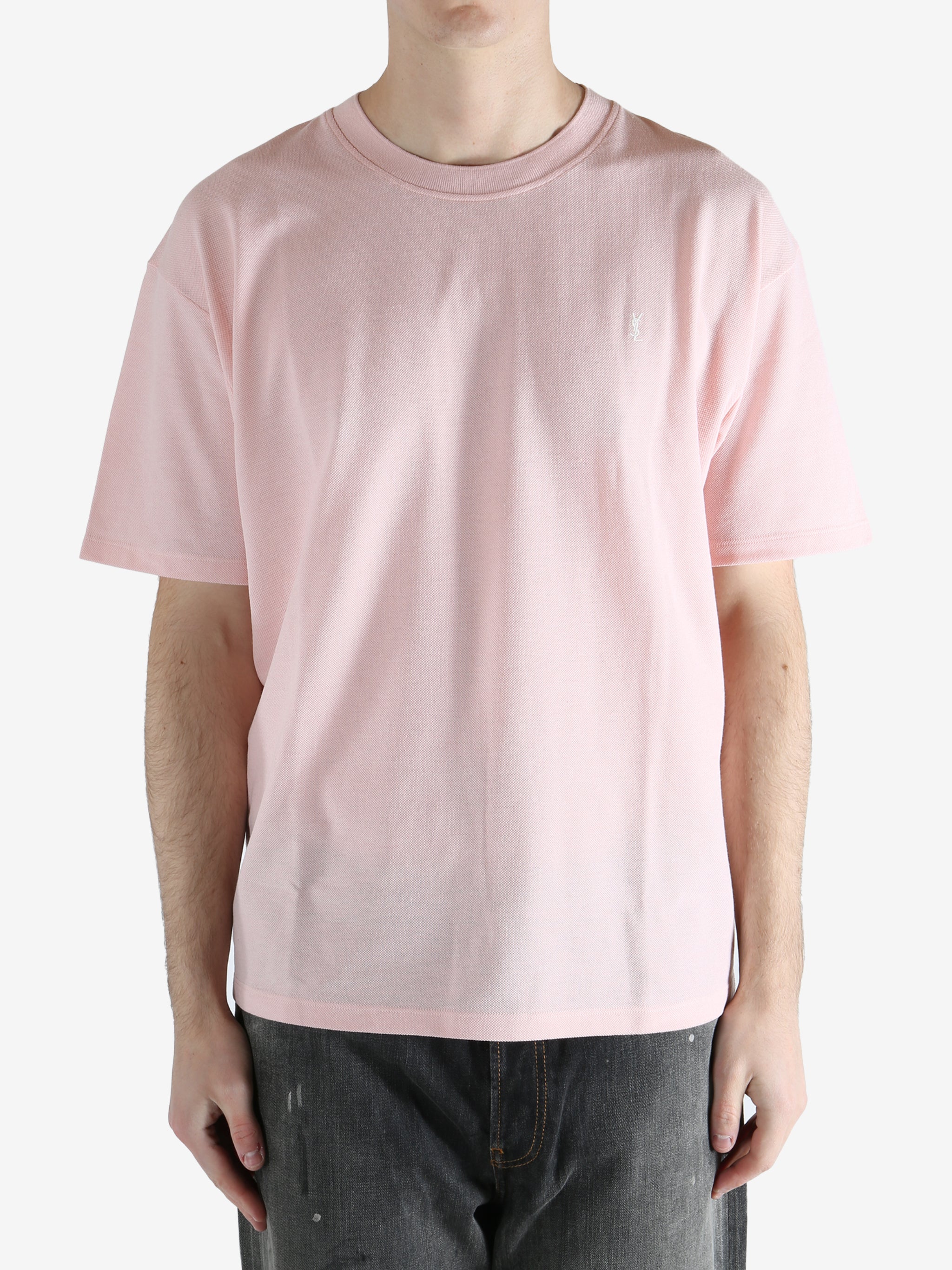 Pink t-shirts worn by a person, showing the shirt's fit